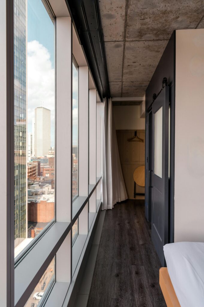 Urban hotel room with panoramic views of the Boston skyline.